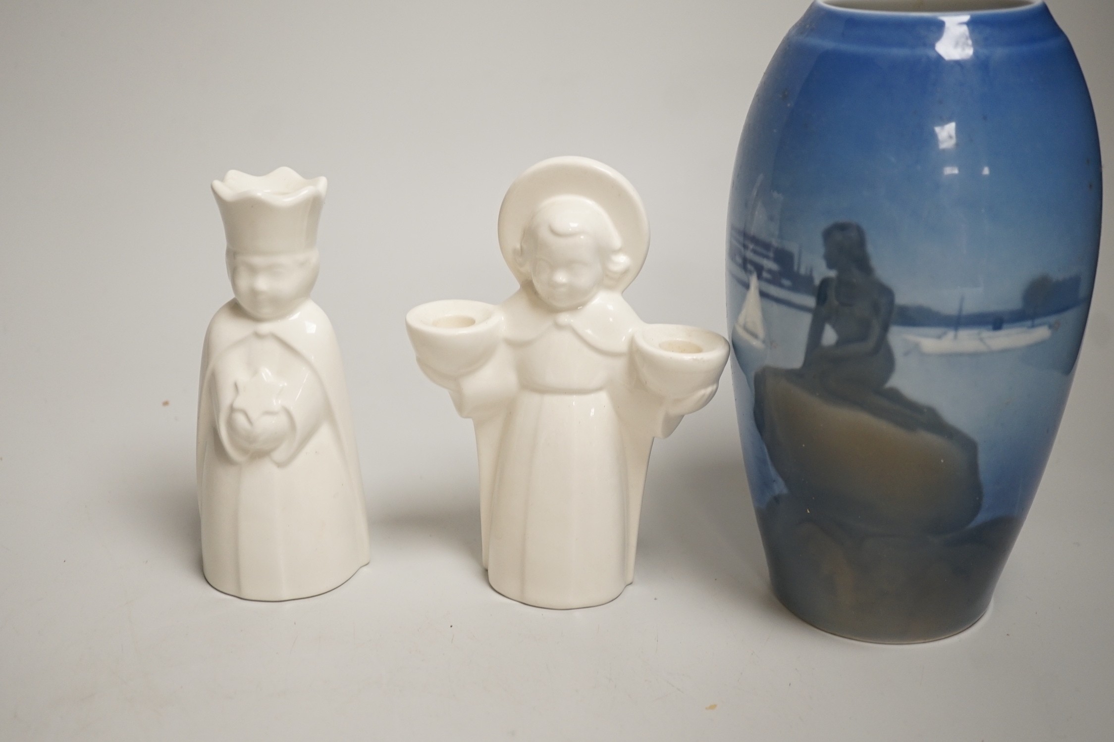 A group of Royal Copenhagen porcelain figural candle holders, a vase, the figure of a polar bear cub and a Mother’s Day dish